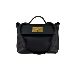 Hermès 24/24 Black Leather Bag With Gold-Tone Hardware.